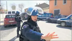  ?? LA DEPECHE DU MIDI VIA AP ?? In this image taken from La Depeche Du Midi, police attend to a hostage incident in Trebes, southern France, on Friday.