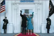  ?? ALEX BRANDON — THE ASSOCIATED PRESS ?? President Joe Biden and first lady Jill Biden wave as they arrive at the North Portico of the White House, Jan. 20.