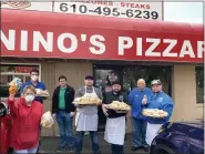  ?? SUBMITTED PHOTO ?? Many hands helped pack the 240lunches Wednesday at Nino’s Pizzaria in Linfield and delivered to area children.
