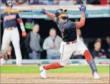  ?? [TONY DEJAK/THE ASSOCIATED PRESS] ?? The Indians’ Carlos Santana watches his RBI double off Orioles starter Wade Miley in the sixth inning.