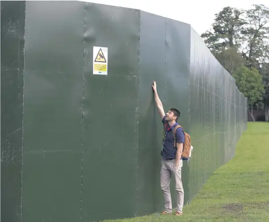  ?? Picture / Brett Phibbs ?? The All Blacks had a fence around their training ground in England during the 2015 Rugby World Cup, to keep away prying eyes.