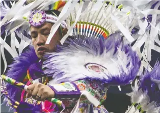  ?? KAYLE NEIS ?? Thousands of people usually travel across the country to dance and reconnect during powwow season. This year, most have been delayed over virus concerns, but some leaders are defying public health orders.