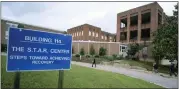  ?? BOB BROWN — RICHMOND TIMES-DISPATCH VIA AP ?? Visitors walk toward Building 114, the S.T.A.R. Center, at Central State Hospital in Dinwiddie County, Va., on May 17, 2018.