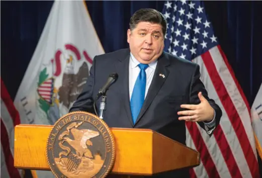  ?? ANTHONY VAZQUEZ/SUN-TIMES ?? Gov. J.B. Pritzker answers questions from the media on the distributi­on of the COVID-19 vaccine last month at the James R. Thompson Center.