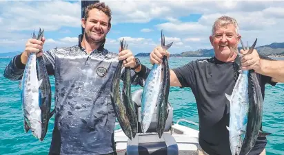  ?? ?? Troy Chatfield and father Robert Chatfield released as many doggie mackerel as they caught while fishing near Magnetic Island. Picture: Eddie Riddle