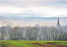  ??  ?? I wandered lonely: a spire emerges from mists on the road to Masham, North Yorkshire