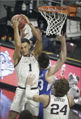  ?? AP photo ?? Gonzaga guard Jalen Suggs grabs a rebound against BYU during the second half of the Bulldogs’ 88-78 win over the Cougars in the West Coast Conference tournament championsh­ip game Tuesday.