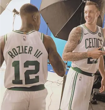  ?? STAFF PHOTO BY MATT STONE ?? GETTING ACQUAINTED: Terry Rozier chats with Daniel Theis, one of his many new Celtics teammates, during yesterday’s media day.