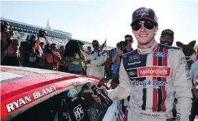  ?? — GETTY IMAGES ?? Ryan Blaney poses with the winner’s decal on his car in Victory Lane after winning the Monster Energy NASCAR Cup Series Pocono 400 at Pocono Raceway on Sunday.