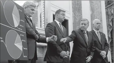  ?? AP/ANDREW HARNIK ?? Sens. Bill Cassidy (left), R-La., and Lindsey Graham, R-S.C., exchange a fist bump Wednesday as they and fellow GOP Sens. Dean Heller (second from left) of Nevada and Ron Johnson of Wisconsin unveil their health care plan on Capitol Hill.