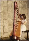  ?? (Special to the Democrat-Gazette) ?? Alisa Coffey, principal harpist of the Arkansas Symphony Orchestra, performs Sunday “In the Atrium” at Fayettevil­le’s Walton Arts Center.