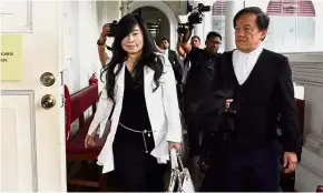  ??  ?? Case continues: Phang leaving the High Court in George Town.