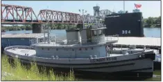  ??  ?? The tug USS Hoga, survivor of the 1941 Pearl Harbor attack, is moored on the Arkansas River in North Little Rock.