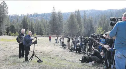  ?? Rich Pedroncell­i
Associated Press ?? AT ECHO SUMMIT, Calif., Gov. Jerry Brown talks to reporters about his new executive order that will require cities and towns to cut water use by 25%. To effectivel­y manage the drought, however, he will need the support of state lawmakers, agencies and...