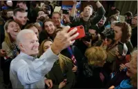  ?? Washington Post photo by Bonnie Jo Mount ?? Former vice president Joe Biden, who rolled to the South Carolina primary, takes selfies with supporters after speaking.