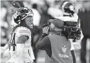  ?? [AP PHOTO/NICK WASS] ?? Pittsburgh strong safety Terrell Edmunds (left) smiles for a television camera after Sunday's 28-24 victory over Baltimore in a game between two AFC North Division powers.