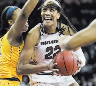  ?? Sean Rayford ?? The Associated Press Forward A’ja Wilson, center, earned first-team All-america honors in her final three years at South Carolina. She is expected to be the WNBA No. 1 pick overall for the Las Vegas Aces.