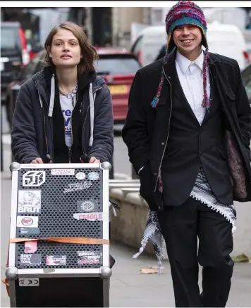  ??  ?? Giving support: Lauri Love with girlfriend Sylvia Mann arrive at court yesterday