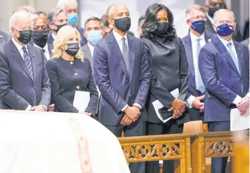  ?? AP ?? (From left) United States President Joe Biden, First Lady Jill Biden, former President Barack Obama, former First Lady Michelle Obama, and former President George W. Bush observe a solemn moment during the funeral for former Secretary of State Colin Powell at the Washington National Cathedral on Friday.