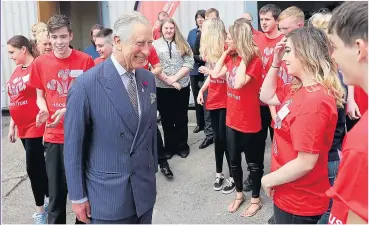  ??  ?? HOPE: The Prince of Wales meets some of the people involved in the trust’s work