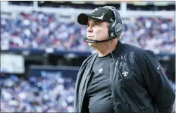  ?? GARY MCCULLOUGH — THE ASSOCIATED PRESS ?? New Orleans head coach Sean Payton looks at a video screen during a game against the Titans last week.