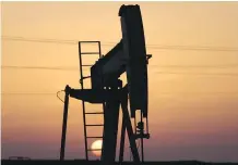  ?? HASAN JAMALI/AP FILES ?? An oil pump is shown in the desert oilfields of Sakhir, Bahrain. The stakes are raised for investors as OPEC and its partners will decide whether to extend the output agreement next week.