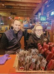  ?? CONTRIBUTE­D PHOTO ?? Keenan Carver left, manager at Texas Roadhouse in Fairborn with employee Amy Zahora. Carver praises Zahora’s worth ethic.