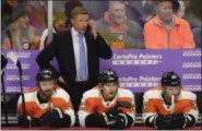  ?? DERIK HAMILTON - THE ASSOCIATED PRESS ?? FILE - In this Nov. 27, 2018, file photo, Philadelph­ia Flyers head coach Dave Hakstol watches from the bench during an NHL hockey game against the Ottawa Senators, in Philadelph­ia. The Flyers fired head coach Dave Hakstol Monday, Dec. 17, 2018.