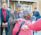  ?? EDDIE MOORE/JOURNAL ?? Santa Fe County Sheriff Robert Garcia consoles relatives of 13-year-old Jeremiah Valencia after a Tuesday news conference in Santa Fe about the boy’s death.