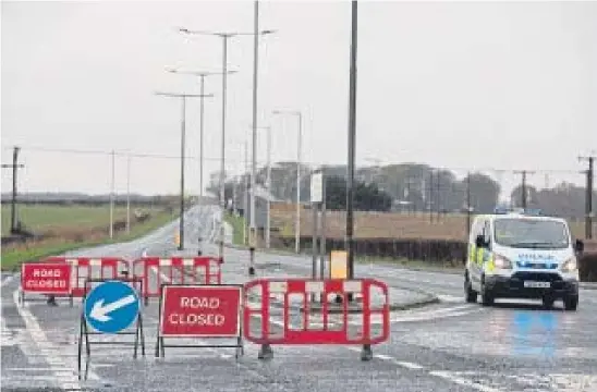  ?? Picture: Kenny Smith. ?? A police van at the closed A915 Standing Stane Road after yesterday morning’s tragic accident.