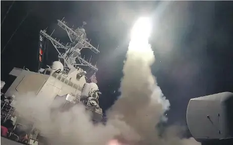  ?? FORD WILLIAMS / U. S. NAVY VIA GETTY IMAGES ?? The U.S. airstrikes on Syria this week mark a stark policy reversal for U.S. President Donald Trump. Dislodging Syrian President Bashar Assad at this point would require a major U.S. commitment, even if all the actual on-the-ground fighting is done by...