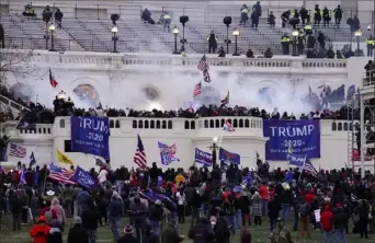  ?? John Minchillo/Associated Press ?? In this Jan. 6 file photo, violent rioters loyal to President Donald Trump storm the Capitol in Washington. A growing number of Republican senators say they oppose holding an impeachmen­t trial, a sign of the dimming chances that Mr. Trump will be convicted on the charge that he incited the siege.