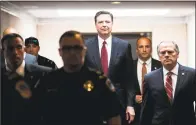  ?? Getty Images ?? Former FBI Director James Comey leaves a closed session with the Senate Intelligen­ce Committee in June.