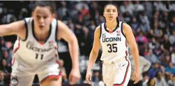  ?? JESSICA HILL/AP ?? Uconn’s Azzi Fudd, right, watches the play during the first half against Georgetown in the quarterfin­als of the Big East tournament March 4.