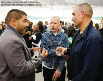  ??  ?? Supreme’s James Jebbia (center) at the opening of the company’s Brooklyn store.