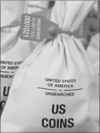  ??  ?? UNSEARCHED: Pictured above are the unsearched Vault Bags loaded with nearly 3 pounds of U.S. Gov’t issued coins some dating back to the 1800’s being handed over to Wisconsin residents by Federated Mint.