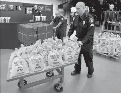  ??  ?? ■ COLORADO RESIDENTS CASH IN: It’s like a modern day Gold Rush. Everyone’s scrambling to get their hands on the heavy, Jumbo Silver Ballistic Bags pictured above before they’re all gone. That’s because residents who find the first 3 digits of their zip code printed in today’s publicatio­n are cashing in on the lowest ever State Minimum price set for the next 2 days by the Federated Mint.