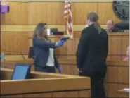  ?? KEITH REYNOLDS — THE MORNING JOURNAL ?? Nicole Villegas, 34, left, reenacts in court the incident that left her live-in boyfriend Lamar Capers, 32, dead. Capers was played by defense attorney Steve Albenze.