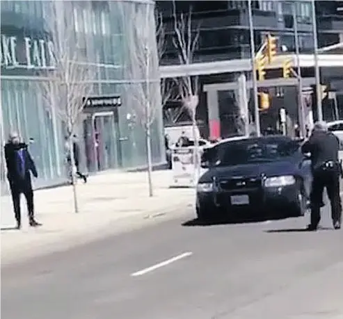  ?? SUPPLIED ?? Const. Ken Lam, right, faces off with Alek Minassian after the van rampage Monday.