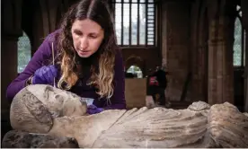  ??  ?? Conservato­r Laura Parker works on the effigy inside St Wilfrid’s church in Derbyshire. Photograph: Ian Hodgkinson/PictureIt Media