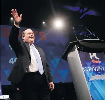  ?? GAVIN YOUNG / POSTMEDIA NETWORK ?? Jason Kenney waves to the crowd in Calgary after a thumping victory in the Alberta PC leadership race on Saturday. There is now a lot of bitterness to overcome in both the PC and Wildrose camps, writes Don Braid.