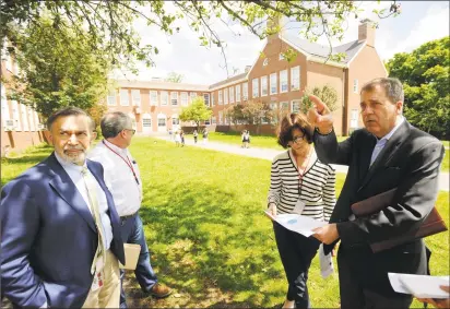  ?? Matthew Brown / Hearst Connecticu­t Media ?? Officials review a proposal to install an elevator at Julian Curtiss School to bring it into compliance with the Americans with Disabiliti­es Act. At the school, from left, are Ralph Mayo, superinten­dent of Greenwich schools; Dan Watson, director of facilities; Principal Trish McGuire and Russ Davidson of KG&D Architects.