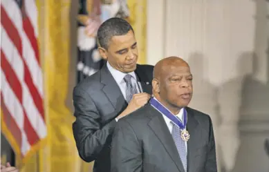  ?? VIA WIKIMEDIA COMMONS ?? The Presidenti­al Medal of Freedom is awarded to Rep. John Lewis of Georgia, a longtime civil rights crusader, by former President Barack Obama.