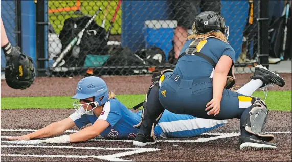  ?? DANA JENSEN/THE DAY ?? Waterford’s Maddie Burrows slides safely in at home plate past the tag of Ledyard catcher Paige Perkins during the Class L state tournament second-round game June 1 at Waterford. The seventh-seeded Lancers (22-4) will take on No. 1 Masuk (25-1) in the state championsh­ip beginning at 6 p.m. today at DeLuca Field in Stratford.