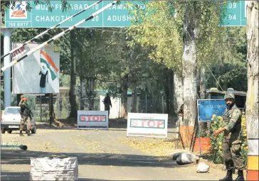  ??  ?? Soldiers stand guard outside the army base which was attacked recently by terrorists in Uri, Jammu &amp; Kashmir