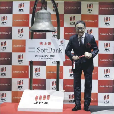  ??  ?? Ken Miyauchi, chief executive of SoftBank, during the company’s listing at the Tokyo Stock Exchange yesterday Bloomberg