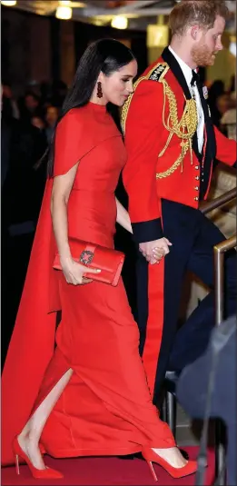  ??  ?? UNIFORM LOOK: Harry and Meghan arrive at Royal Albert Hall last night