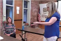  ?? The Sentinel-Record/Donald Cross ?? ■ Hot Springs Housing Authority Deputy Director Linda Langan, left, and Housing Choice Voucher Director Bobbi Partain discuss the Section 8 program Tuesday at Transporta­tion Depot.