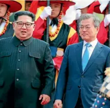  ?? AP ?? North Korean President Kim Jong Un, left, and his South Korean counterpar­t, Moon Jae In, at the border village of Panmunjom in the Demilitari­zed Zone late last week. Kim may have felt his nuclear weapons programme gave him a trump card, say the writers.