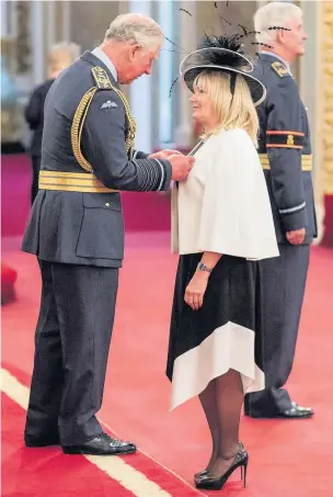  ??  ?? ●●The Seashell Trust’s Sherann Hillman receiving her MBE from HRH the Prince of Wales at Buckingham Palace